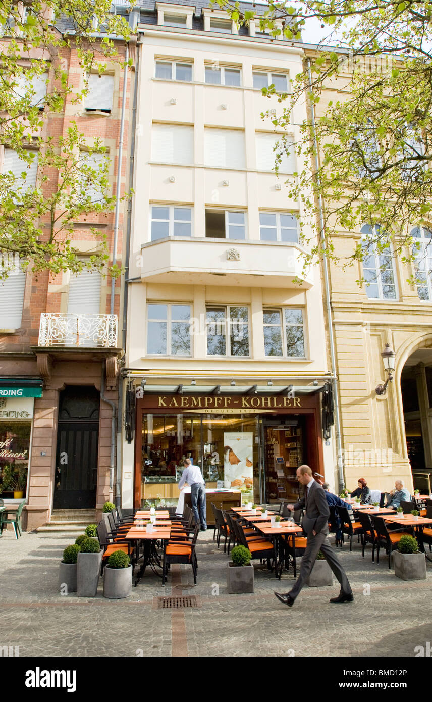 Street cafe in Luxembourg in the morning with some patrons sitting at