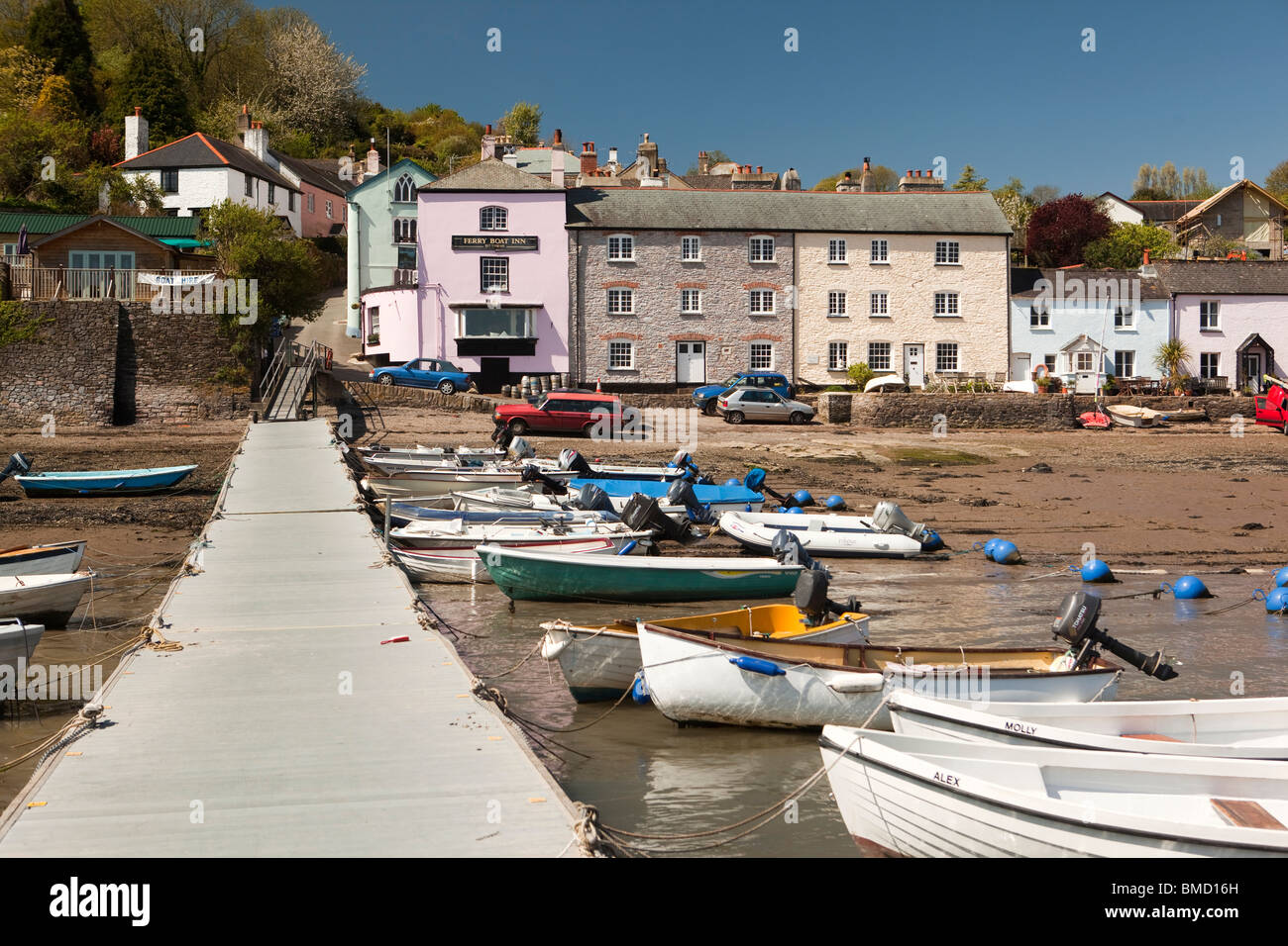UK, England, Devon, Dittisham, yacht tenders moored in front of colourfully painted riverside houses on the Quay Stock Photo