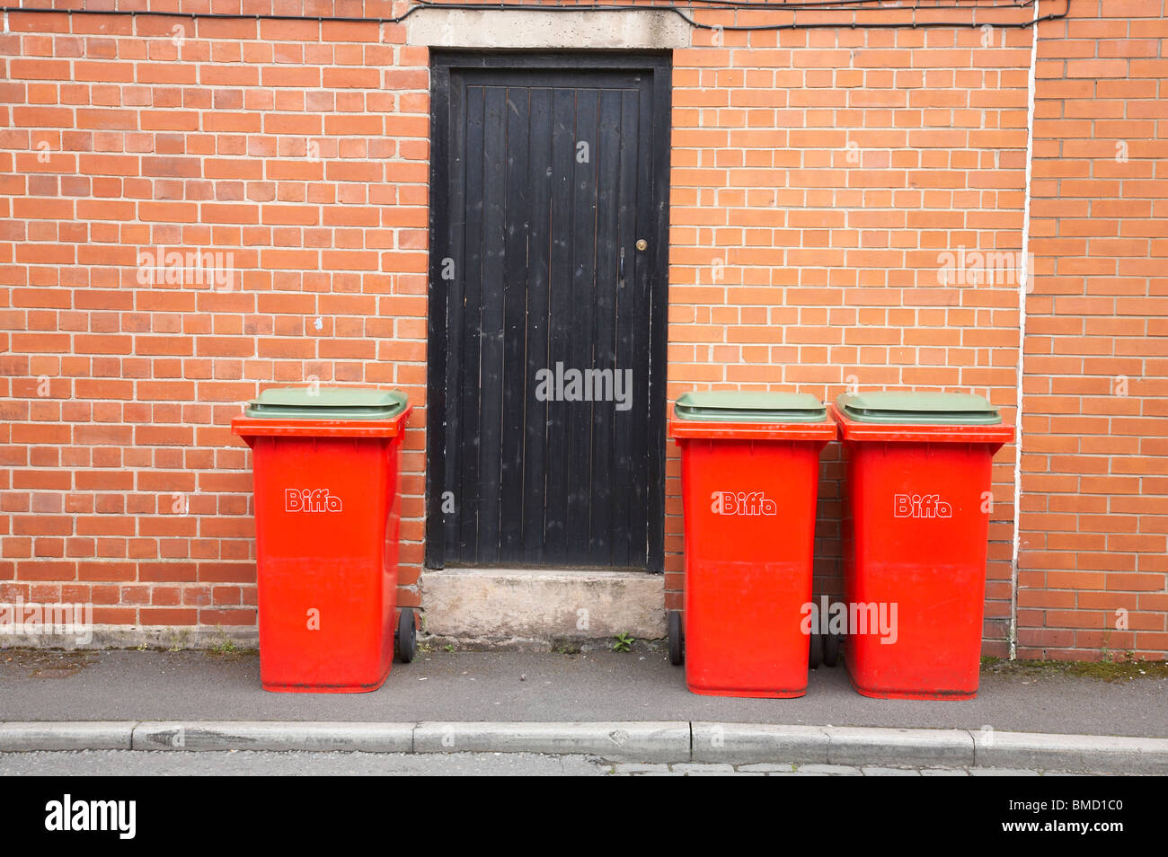 Rubbish containers waiting to be collected Stock Photo Alamy
