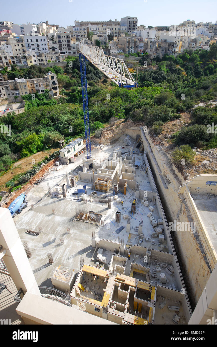 ST JULIAN'S, MALTA. Laying the foundations for yet another hotel at Balluta Bay. Viewed from Le Meridien Hotel next door. 2010. Stock Photo