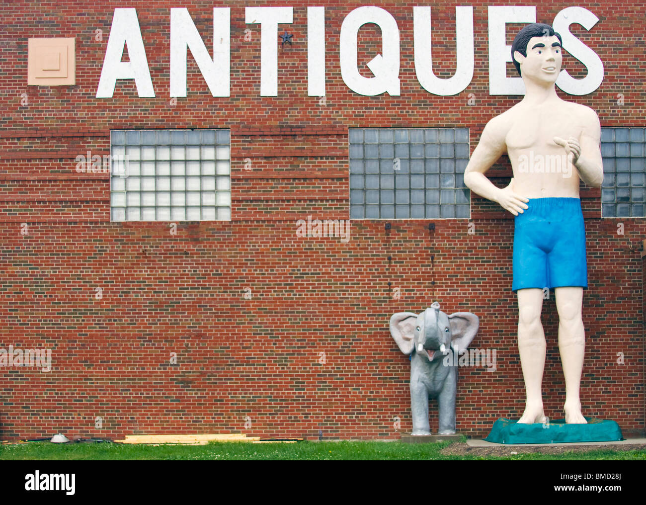 Giant Beach Dude and Elephant at an antique store in Livingston Illinois Stock Photo