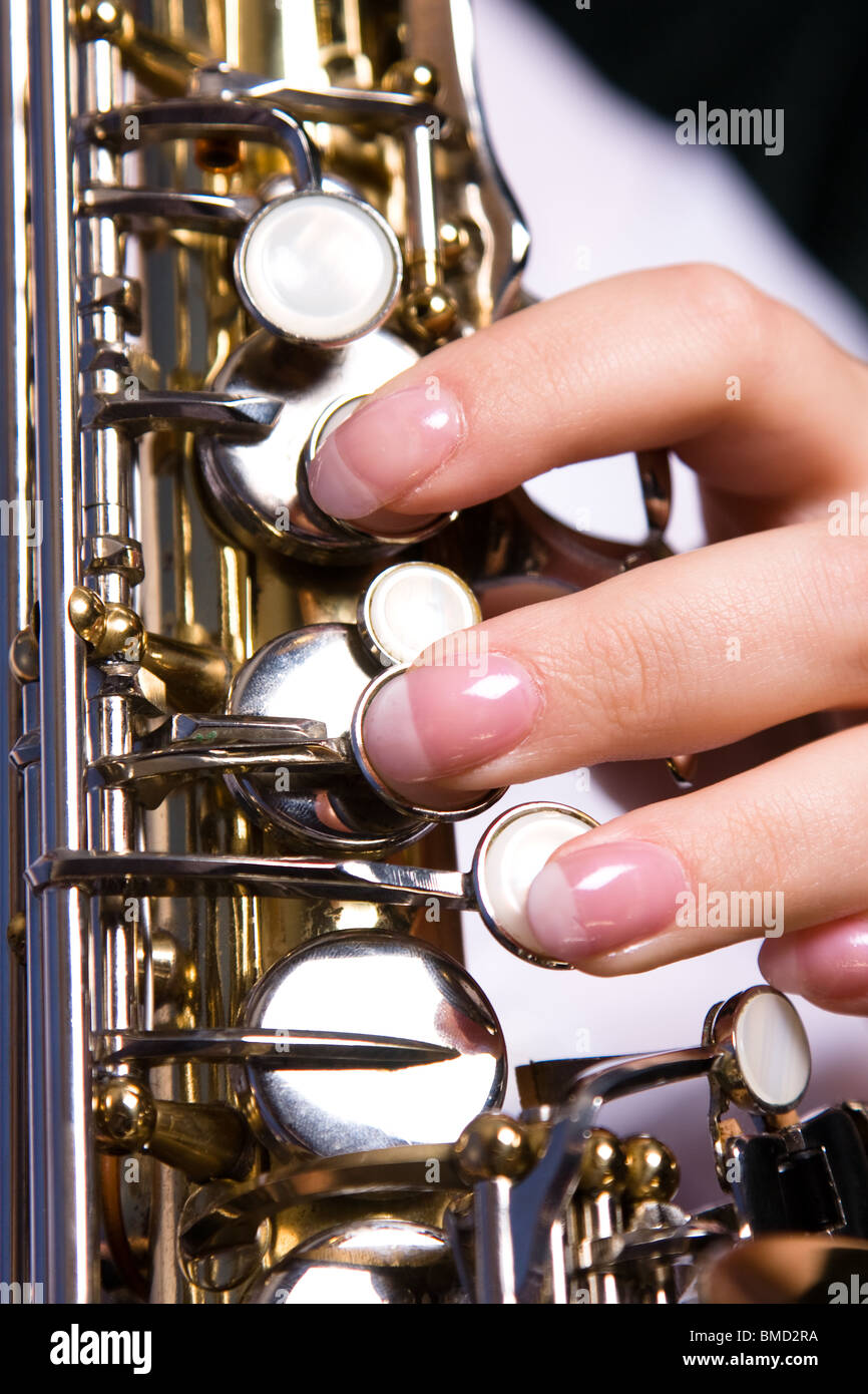 Girl playing saxophone hi-res stock photography and images - Alamy