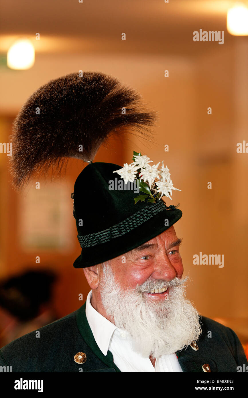 Man with White Beard Wearing a Gamsbart, Traditional Bavarian Dress Hat, Upper Bavaria Germany. Stock Photo