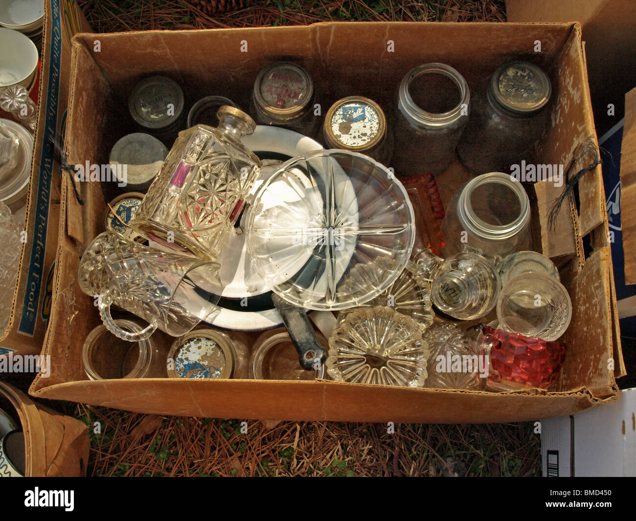 auction yard sale box lot glass decanter plate jars glasses cardboard