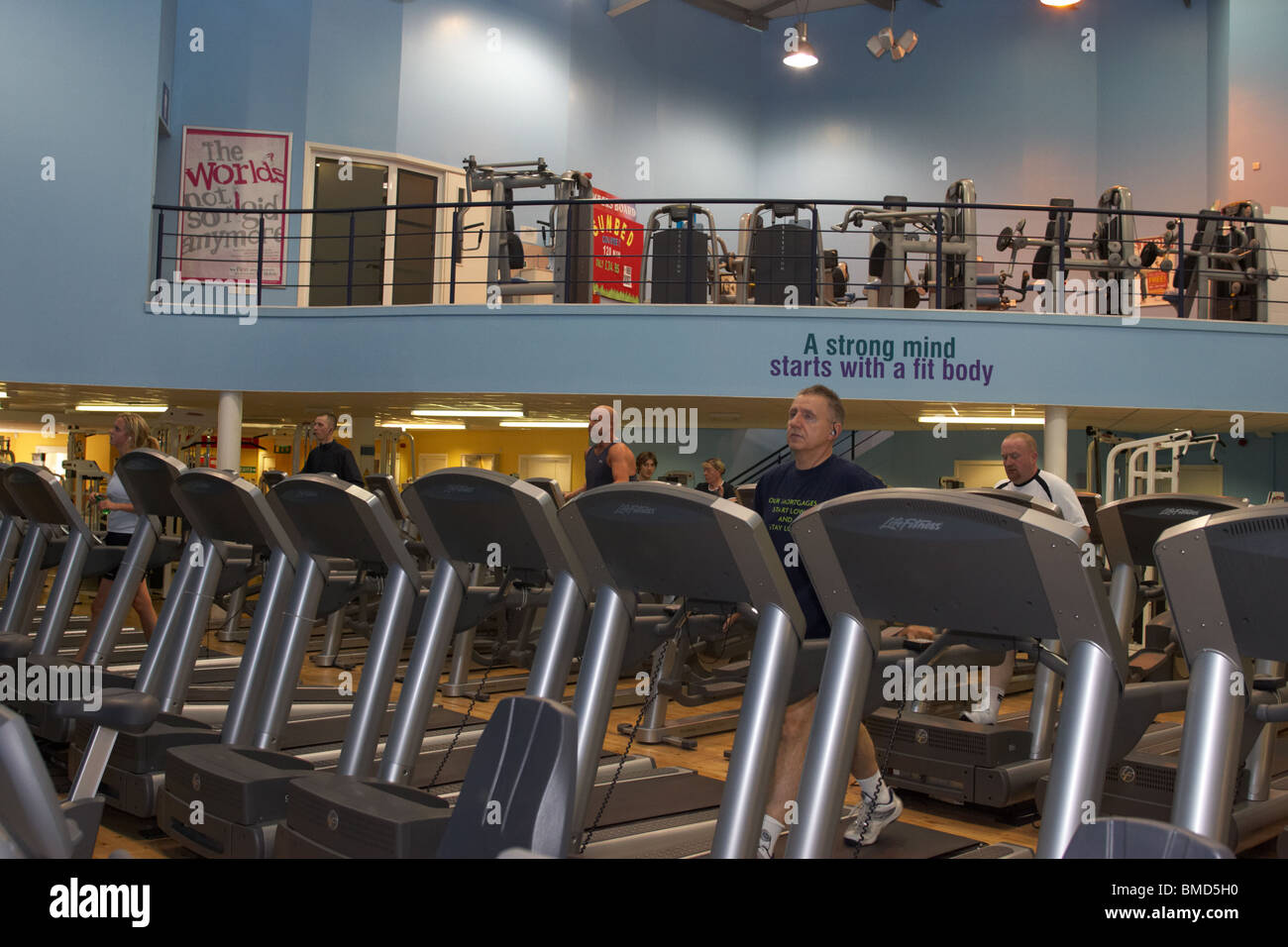 row of treadmills gym equipment in a modern fitness suite Stock Photo -  Alamy