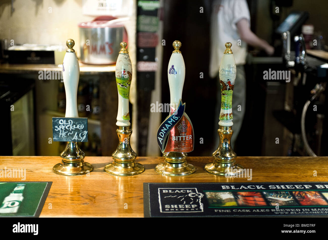 Beer pump handles in a traditional pub in Essex. Stock Photo