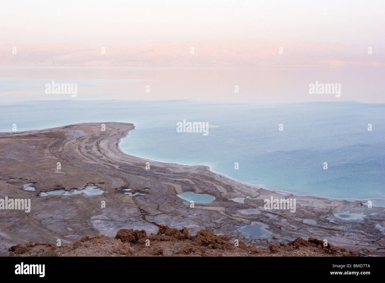 A view of the Dead sea at sunset, On Nov 3, 2008. The rapidly receding water (Approx. 5 cm per month) and sinkholes can be seen Stock Photo
