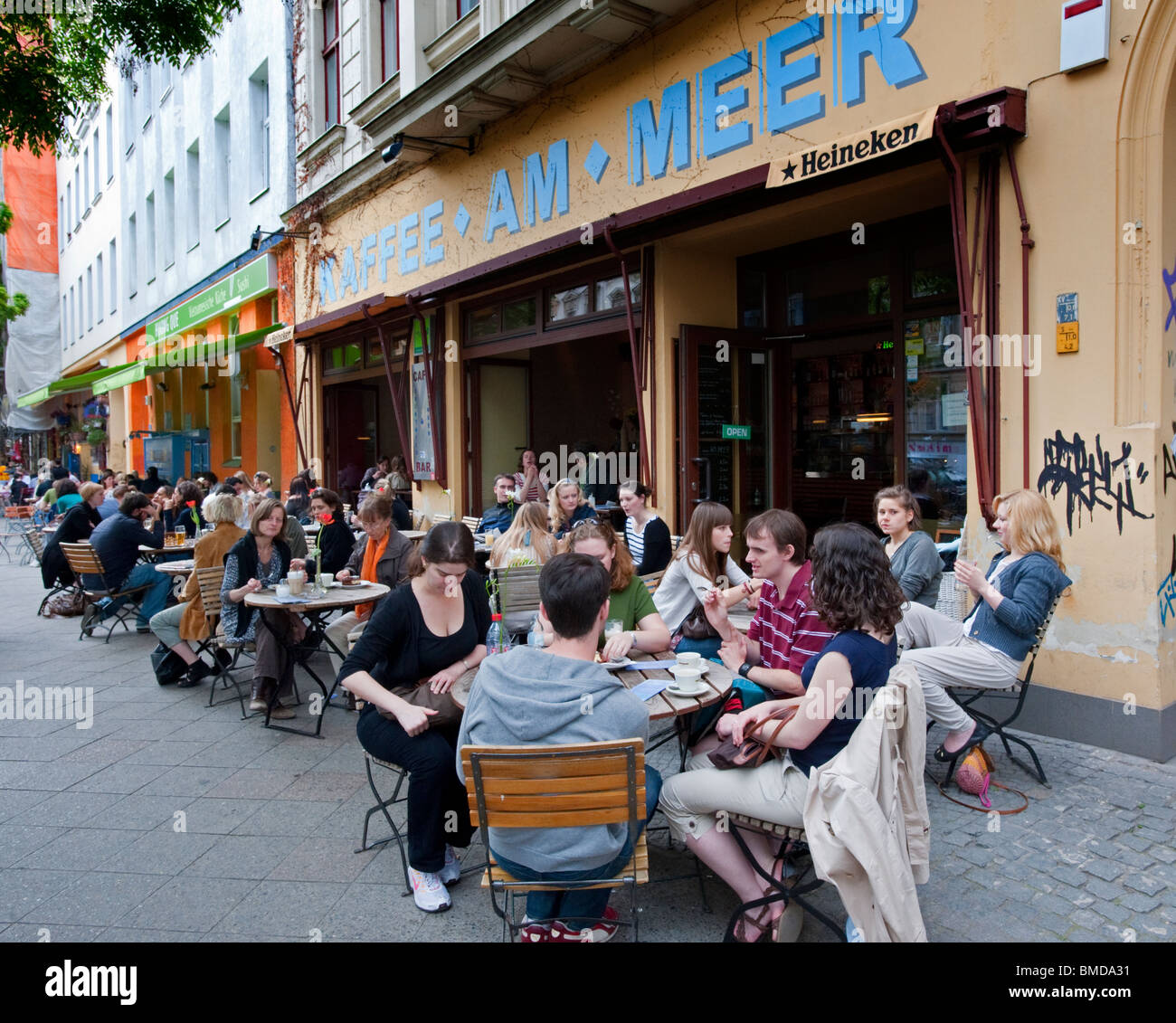 Pavement cafe on trendy Bergmannstrasse in Kreuzberg Berlin Germany Stock Photo