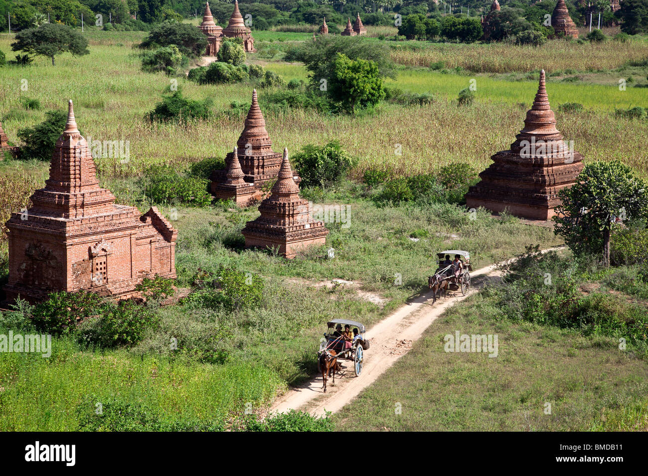 Tourist visiting Buledi group temples on a horse cart. Bagan. Myanmar Stock Photo