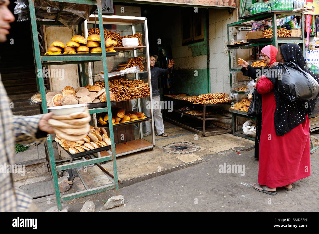 buying bread , daily ritual in the back alley communities of Al