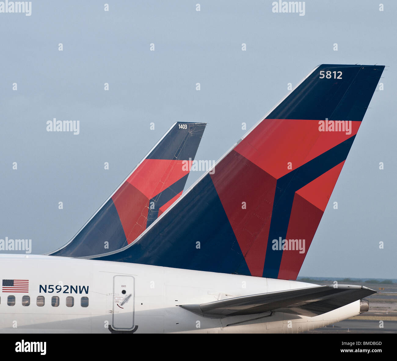 Delta Air Lines logos on the tail section of two of the company's passenger jets. Stock Photo