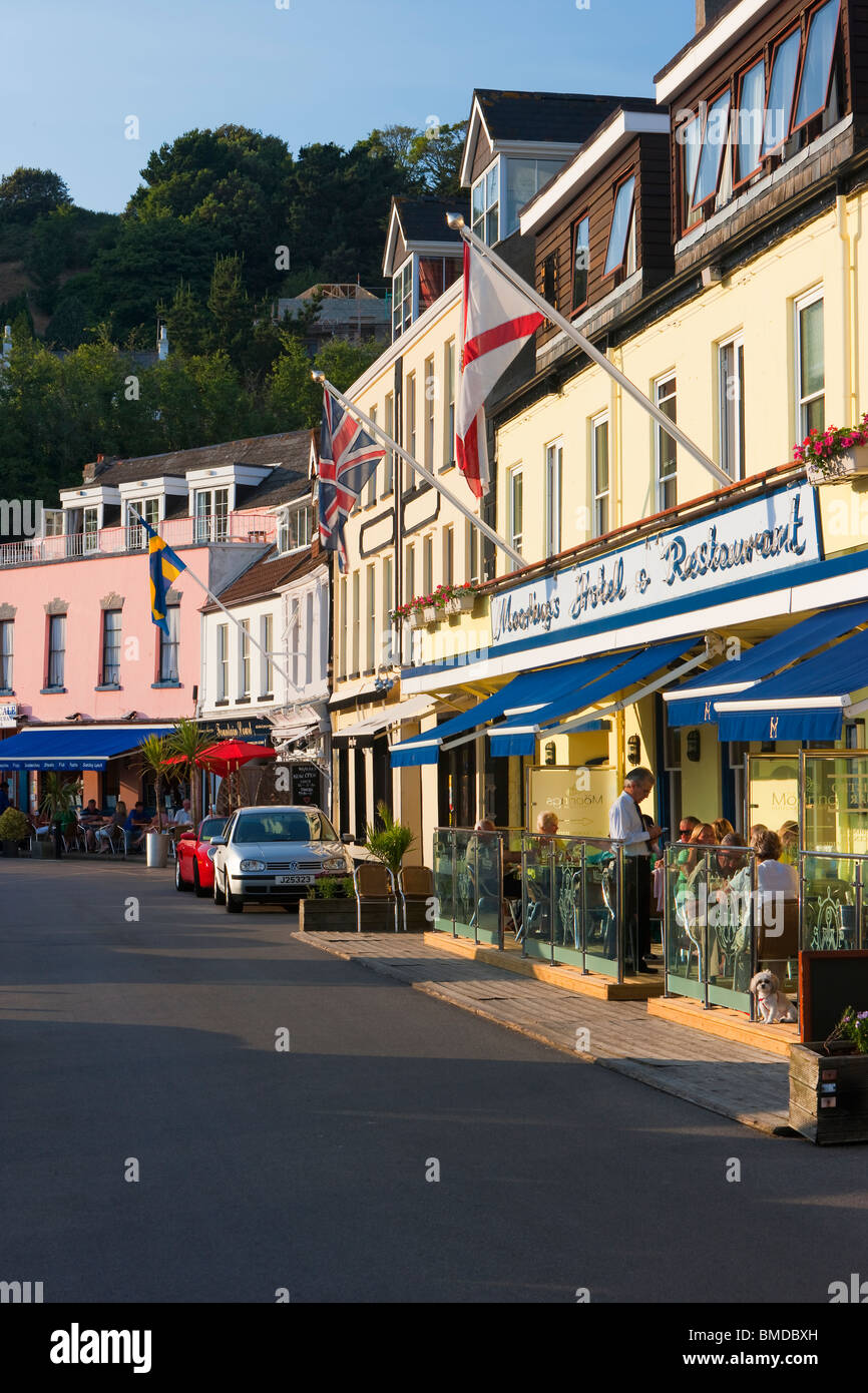 Tourists sitting outside restaurants and bars, Gorey harbour, Jersey