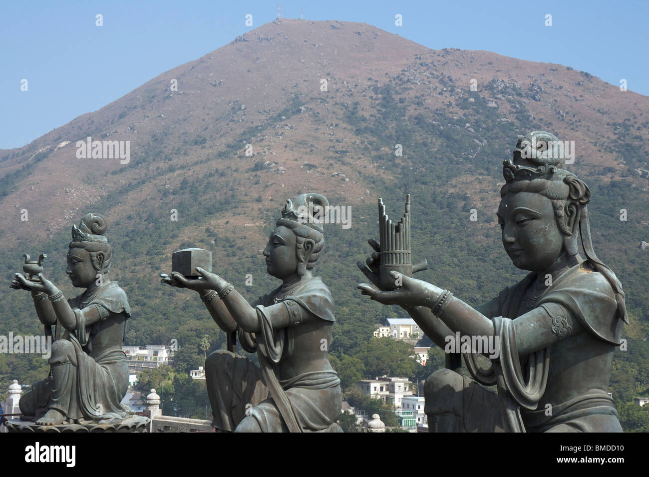 Three Devas Buddhistic statues praising and making offerings to the Tian Tan Buddha on Lantau Island, Hong Kong, China. Stock Photo