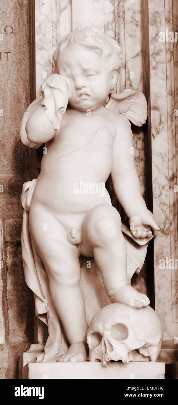 Cherub standing on skull in York Minster. York, England, UK Stock Photo