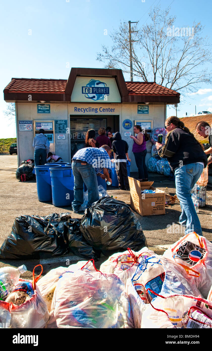 People recycling aluminium cans in Recycling Center in Re store