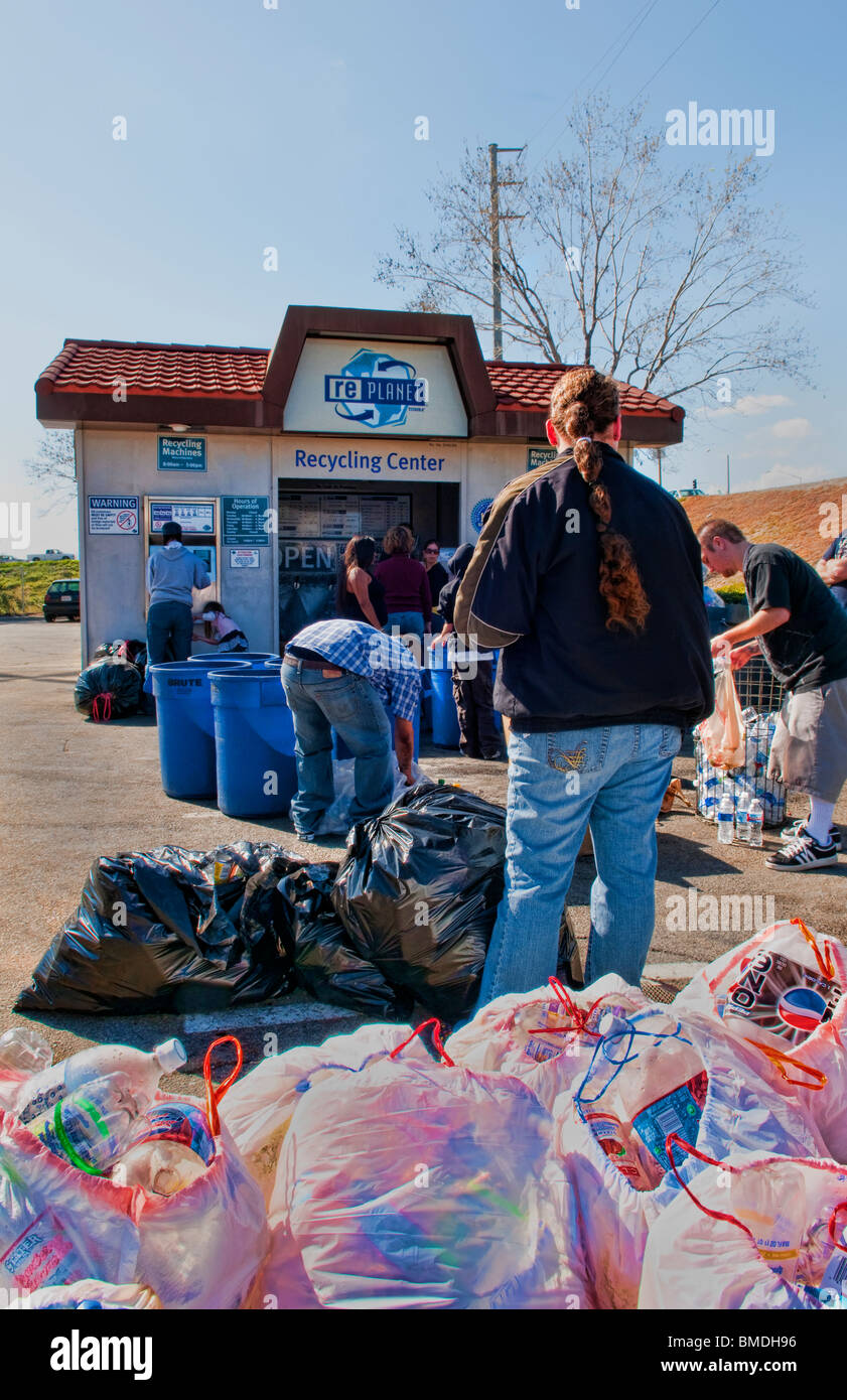 People recycling aluminium cans in Recycling Center in Re store