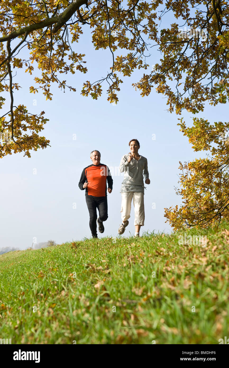 Mature Couple Running Stock Photo