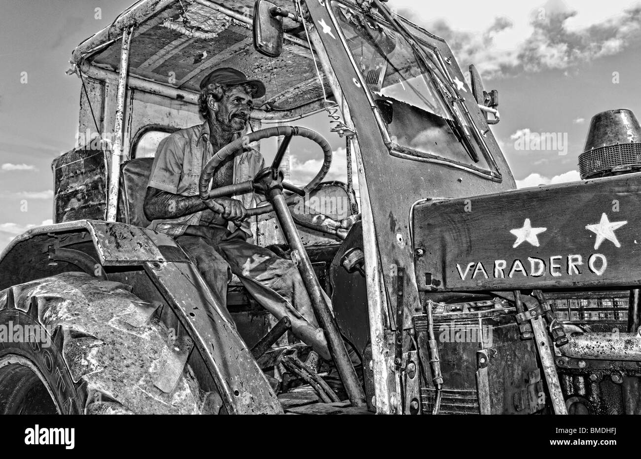 Man driving tractor Black and White Stock Photos & Images - Alamy