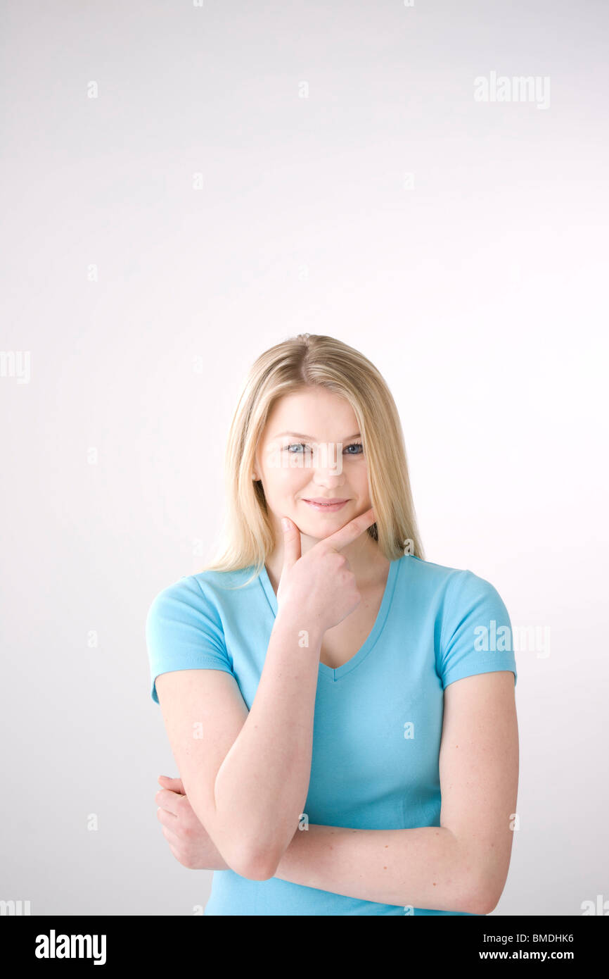 Woman hand on chin hi-res stock photography and images - Alamy