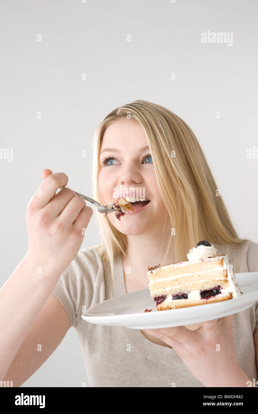 Woman Eating Cake Stock Photo
