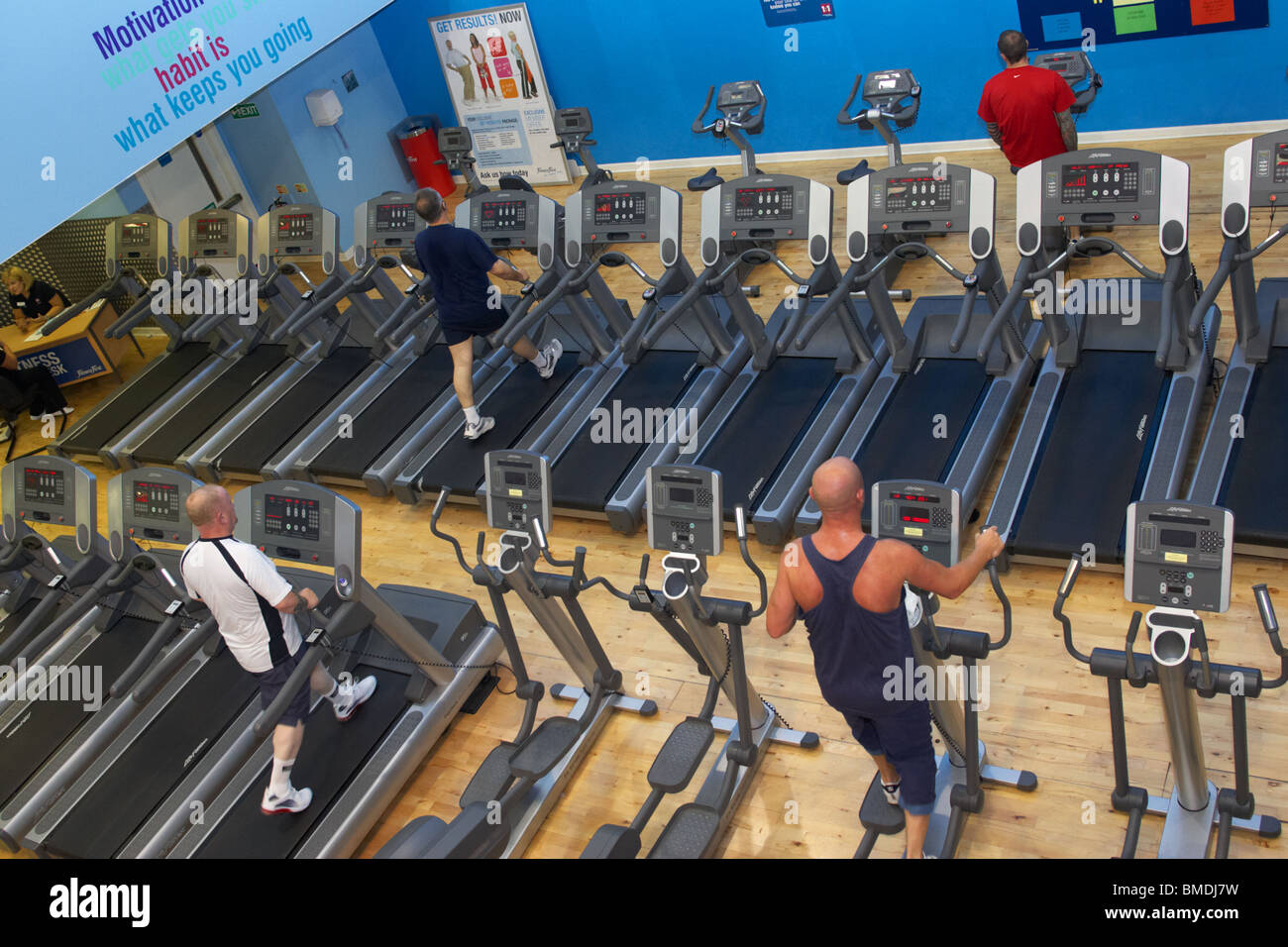 row of treadmills gym equipment in a modern fitness suite Stock Photo