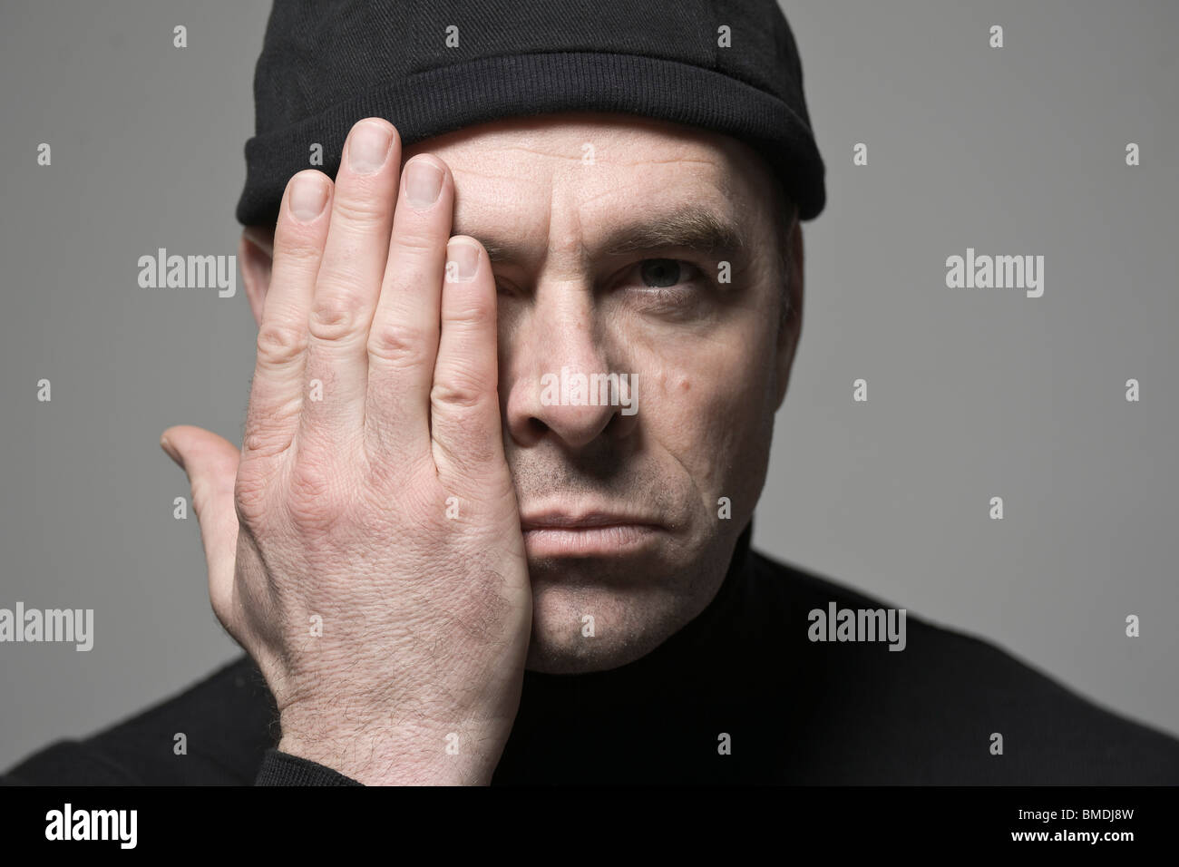 Man Covering One Side of His Face Stock Photo - Alamy