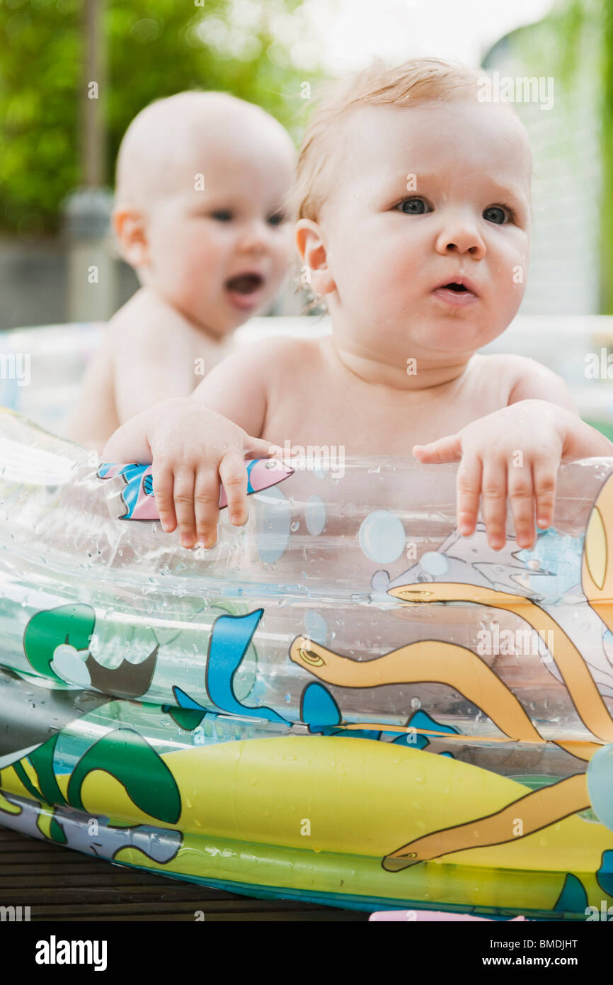 Two Babies in Inflatable Pool Stock Photo Alamy