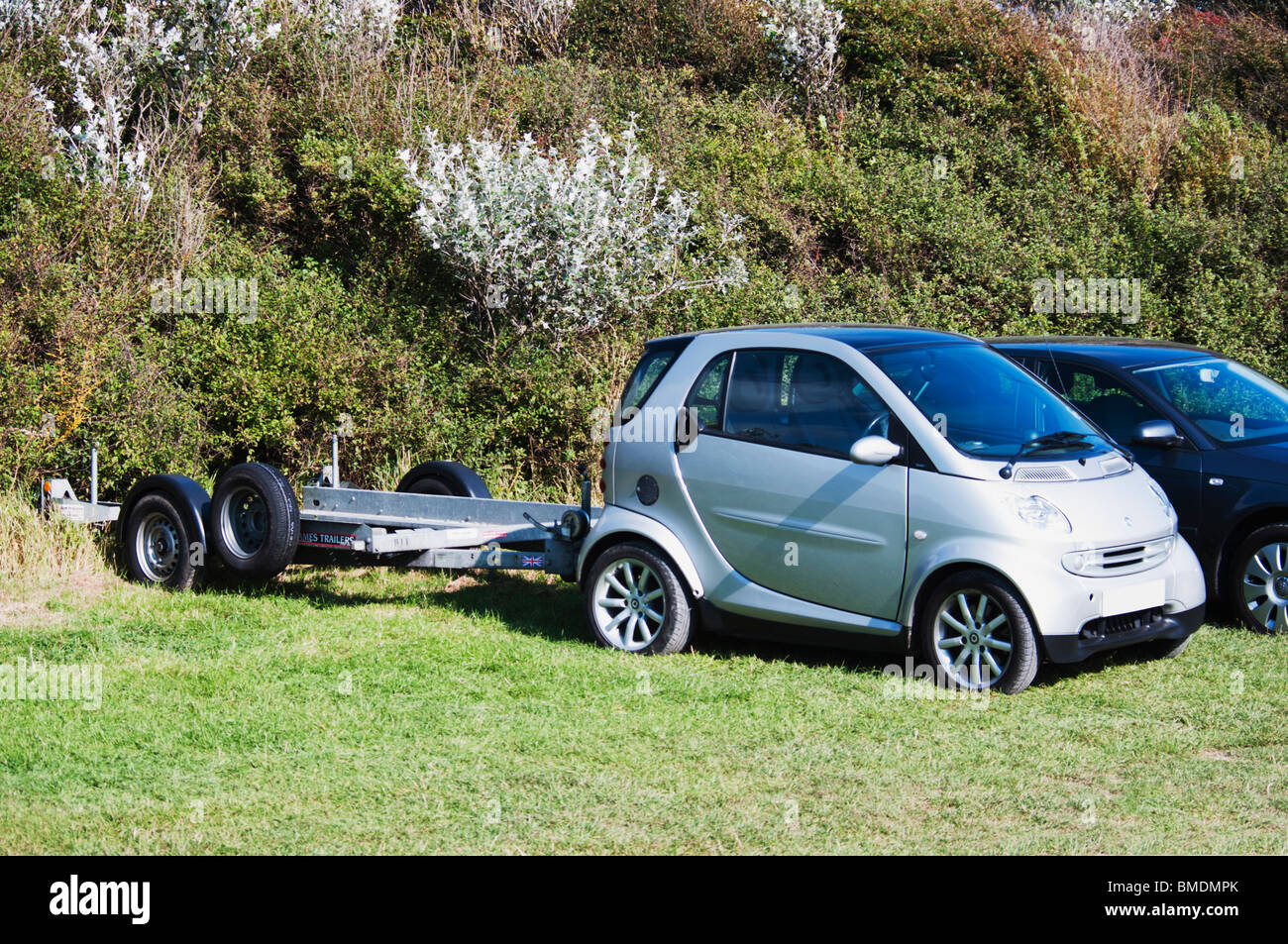 smart car with boat towing trailer Stock Photo Alamy