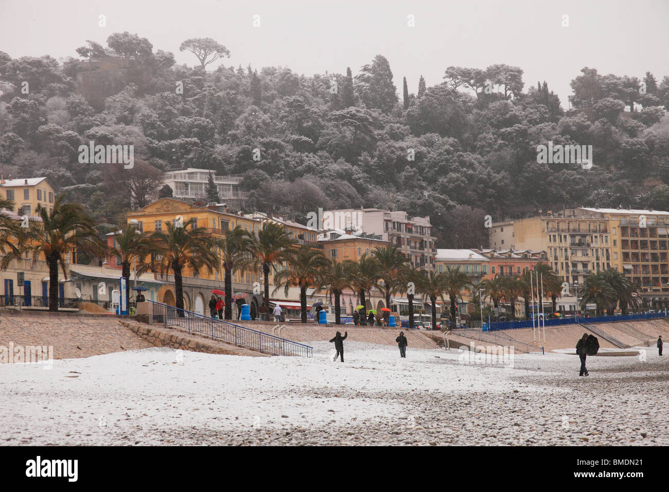 Snowed beach in winter time in Nice city. Snow in French Riviera is rare and  happen approximately every 10 years. Stock Photo