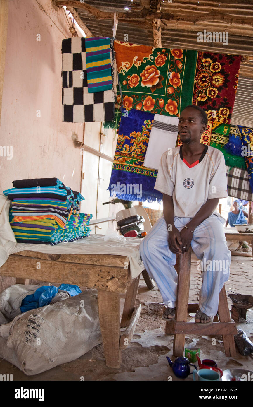 A Fulani man sells blankets and rugs in the marketplace in Segou, Mali