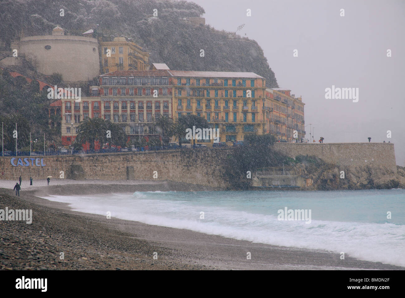 Snowed beach in winter time in Nice city. Snow in French Riviera is rare and  happen approximately every 10 years. Stock Photo