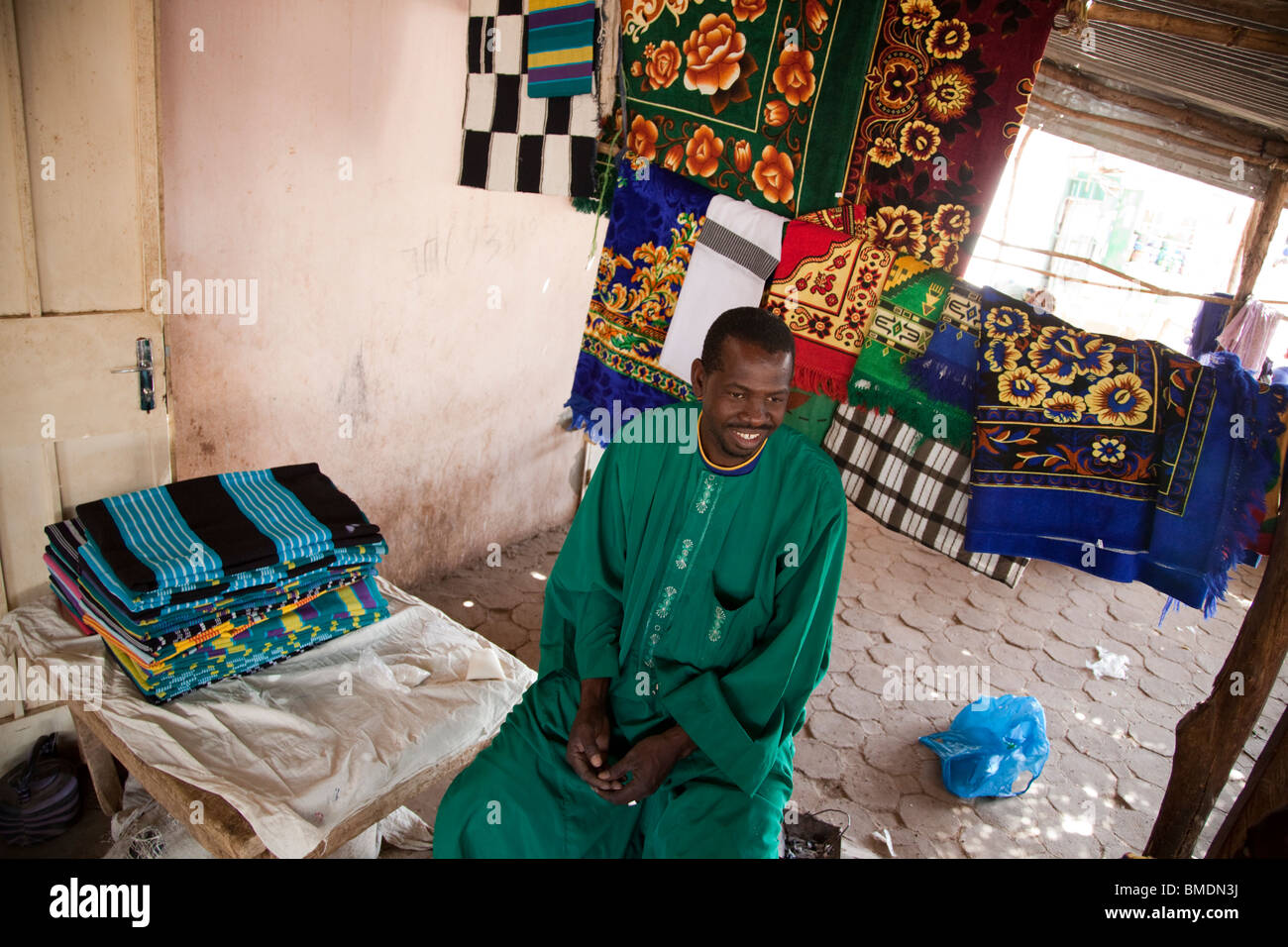 A Fulani man sells blankets and rugs in the marketplace in Segou, Mali