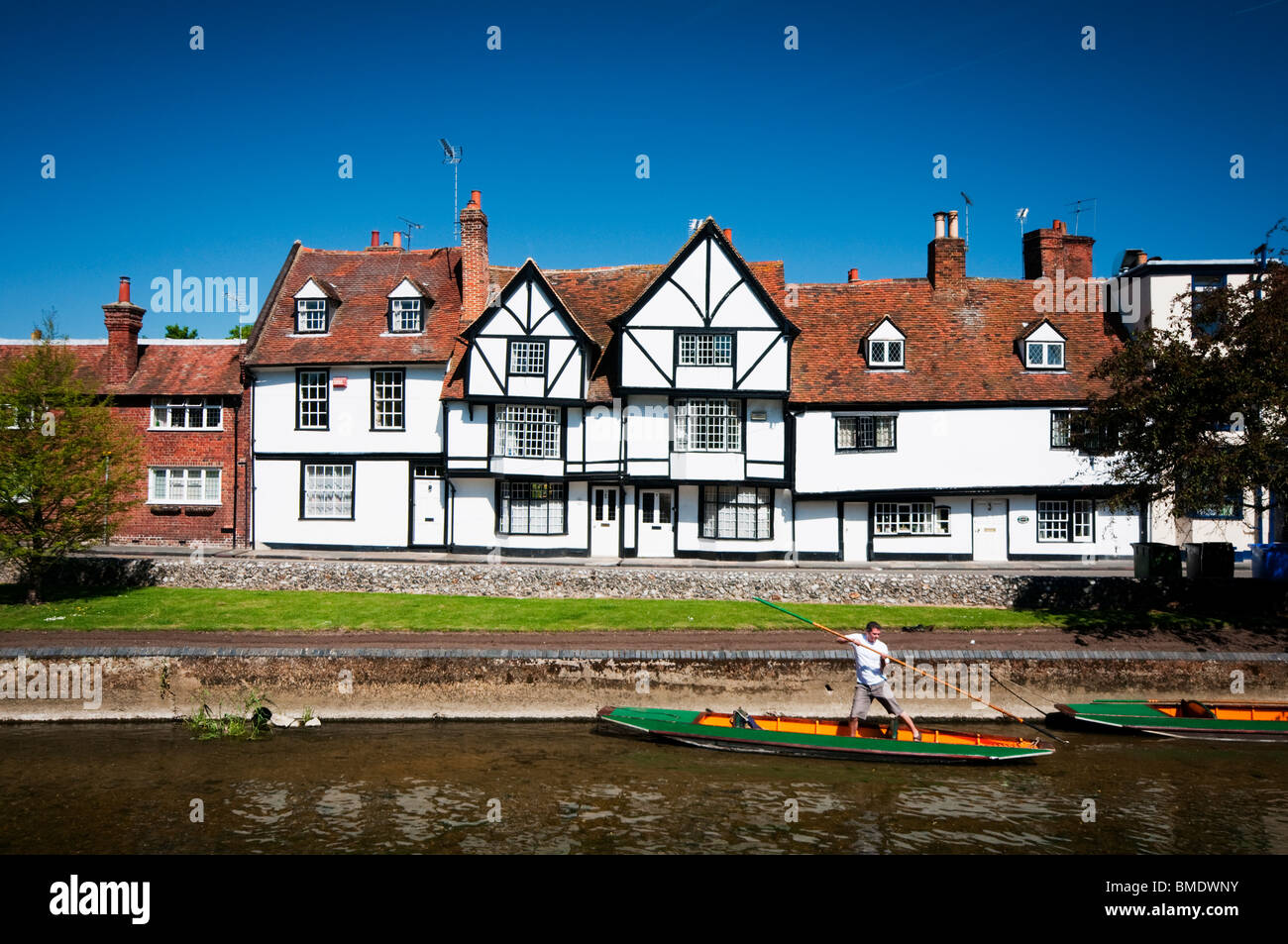 A boat punter on the river Stour in Kent with some nice buildings in the background. Stock Photo