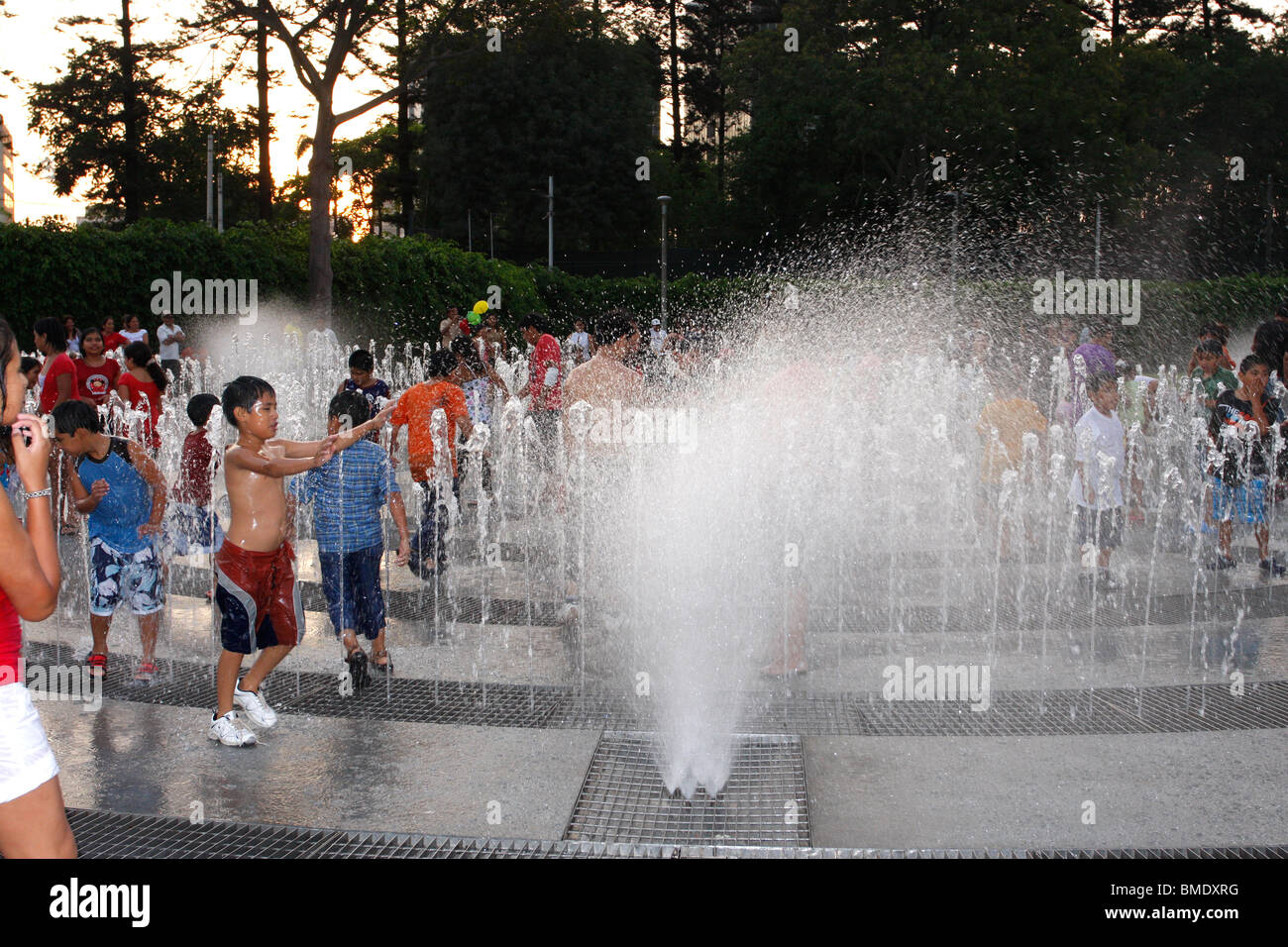 Children playing in one of the walk-in synchronized water fountains on the Magic Water Tour,Park of the Reserve,Lima,Mexico Stock Photo