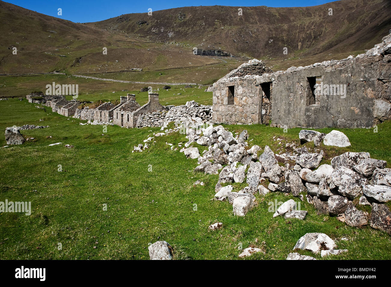 The abandoned cottages in the deserted main street of Village Bay on the island of St. Kilda Stock Photo