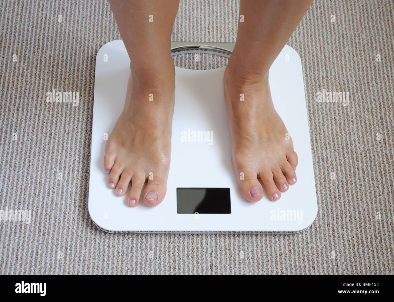 Female feet on bathroom scale Stock Photo Alamy