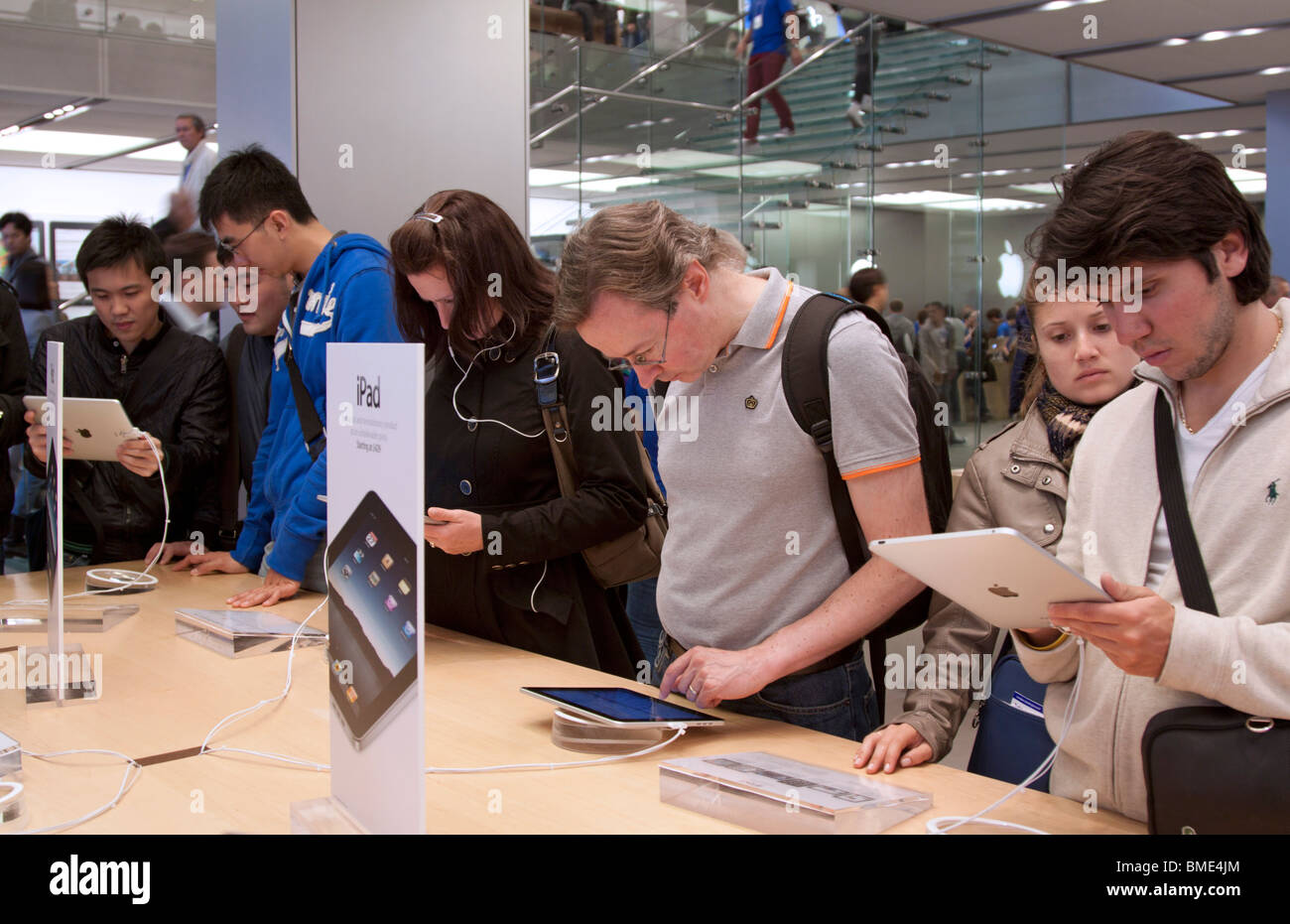 People using iPad - Apple Store - Regents Street - London Stock Photo
