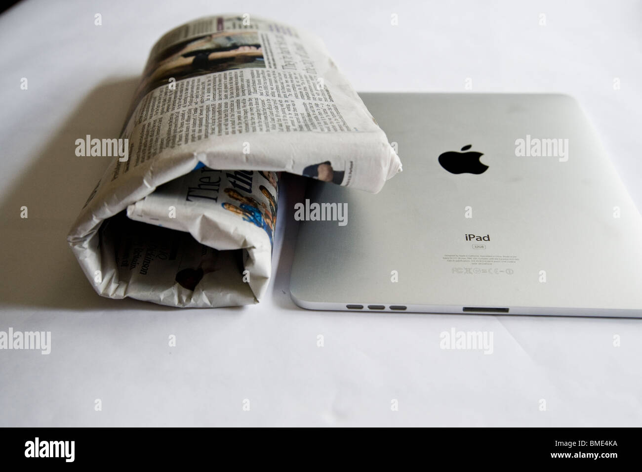 Newspaper compared to Apple iPad, Touchscreen Tablet Computer, Book