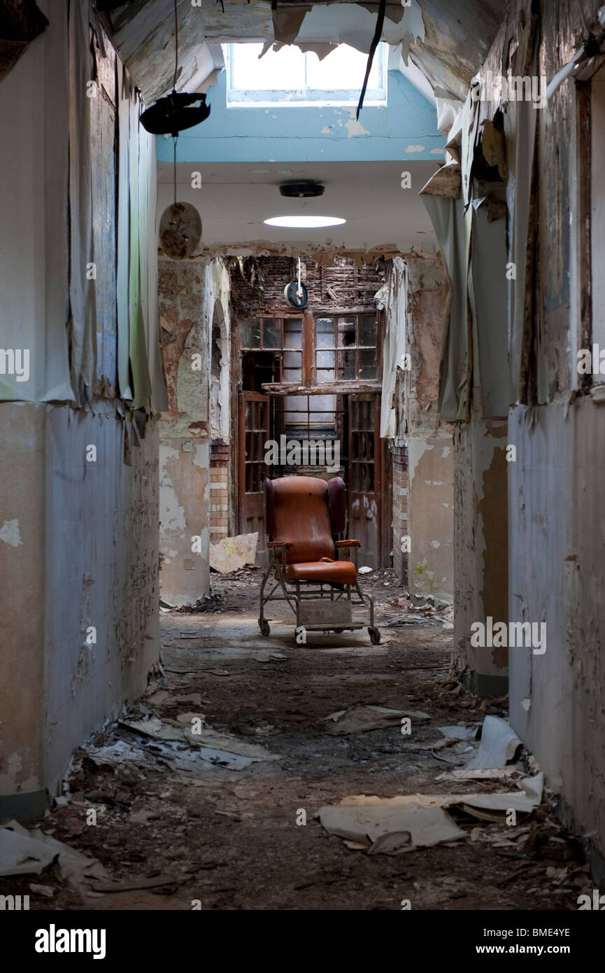 Abandoned Hospital Chair in a Derelict Psychiatric Asylum Stock Photo