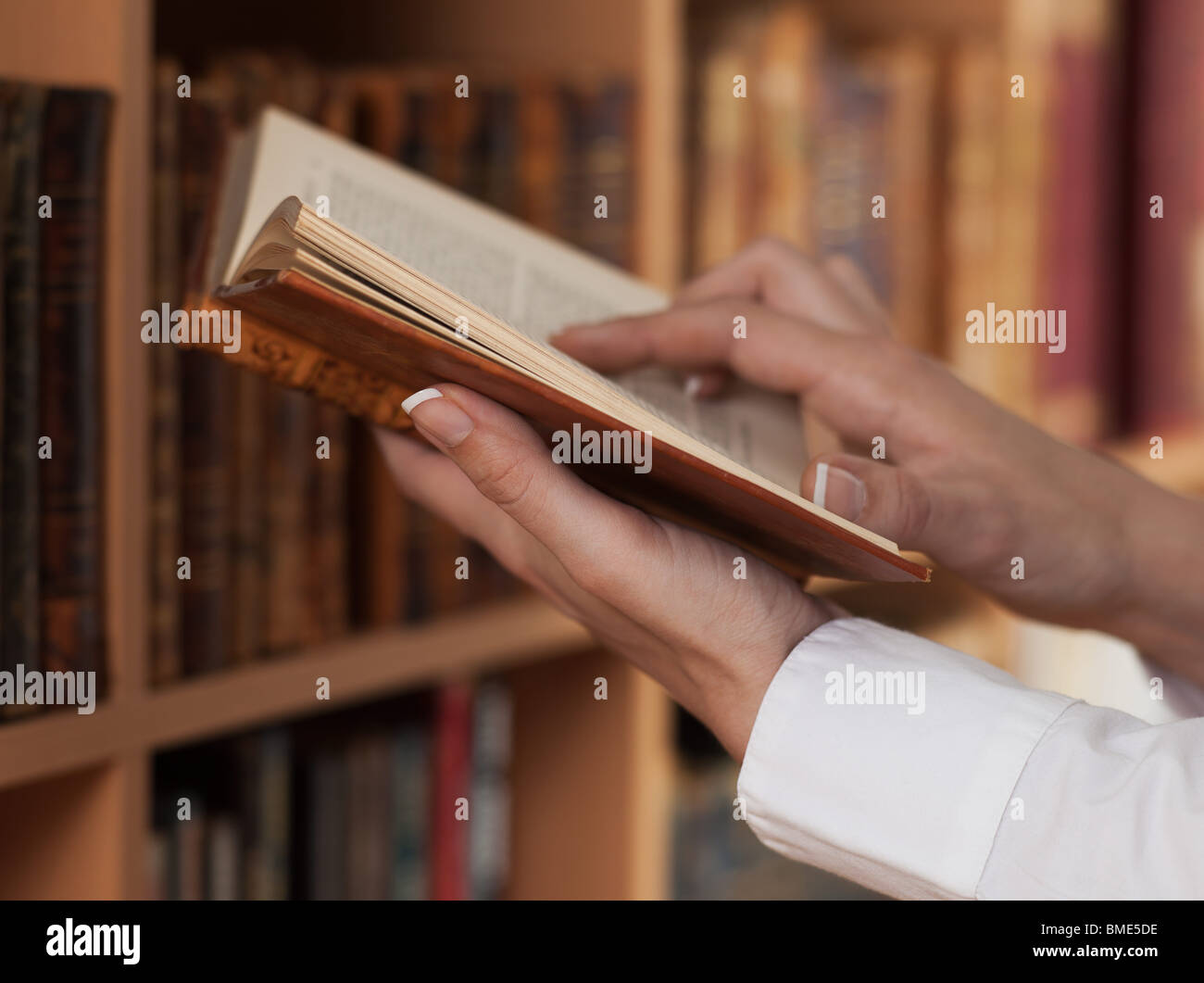 woman hands holding reading ancient  book Stock Photo