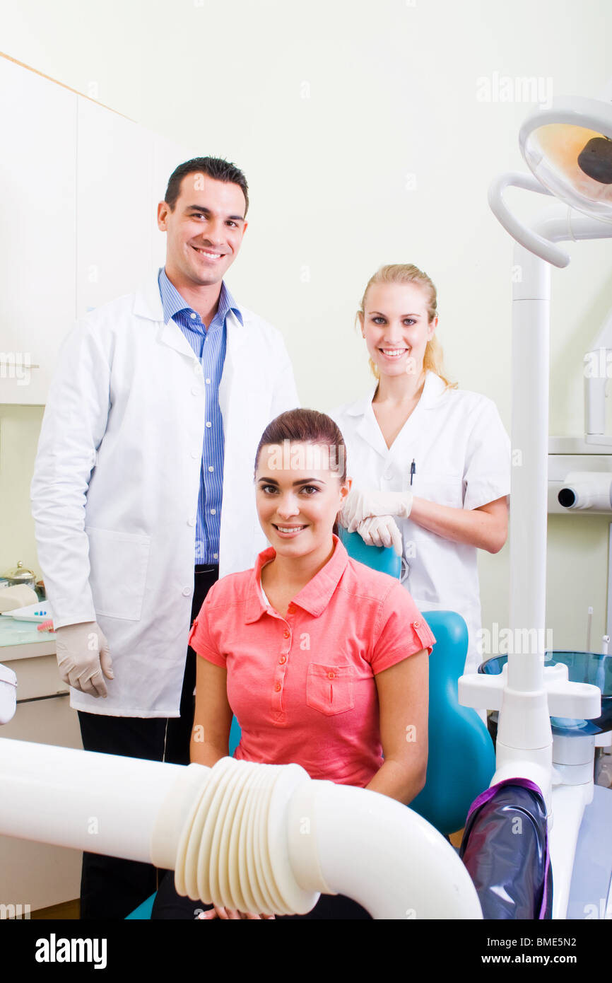 dentist, assistant and patient in dental office Stock Photo Alamy