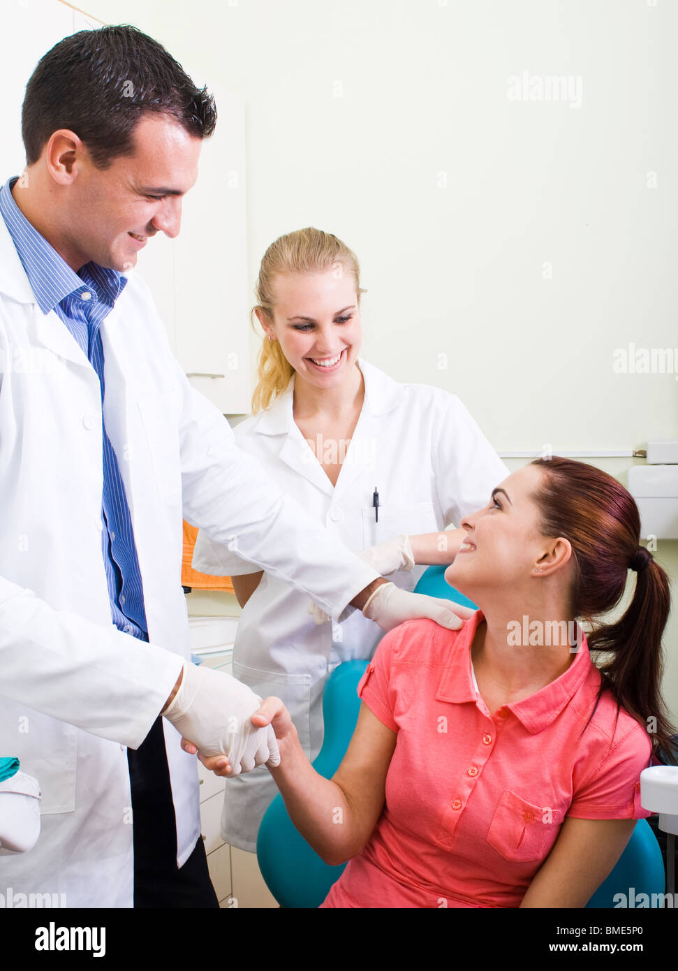 dentist or doctor congratulate patient for a successful operation Stock Photo