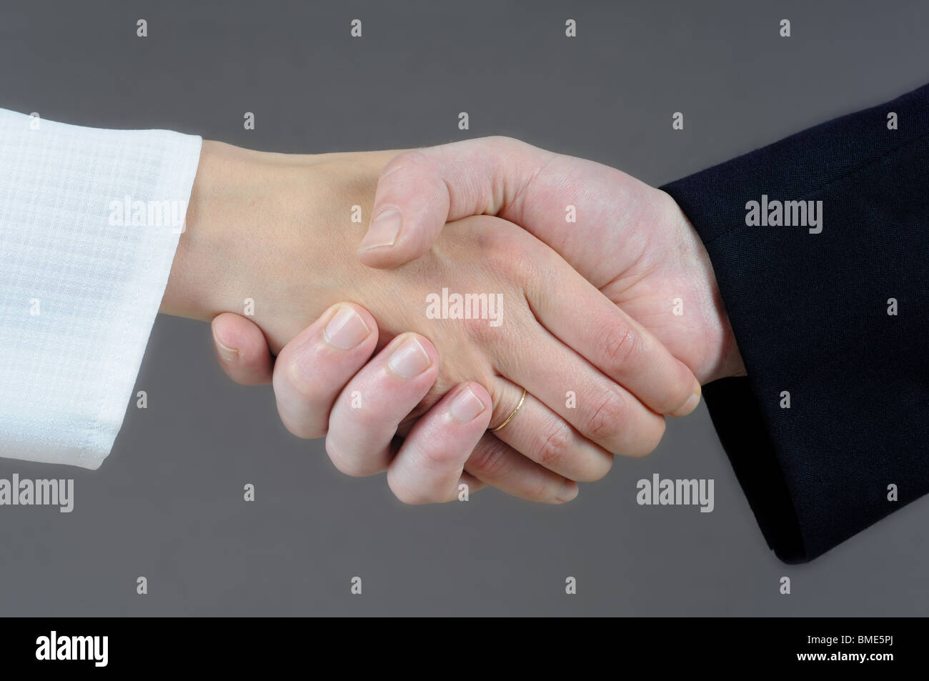 Handshake concept - male and female hand. Stock Photo