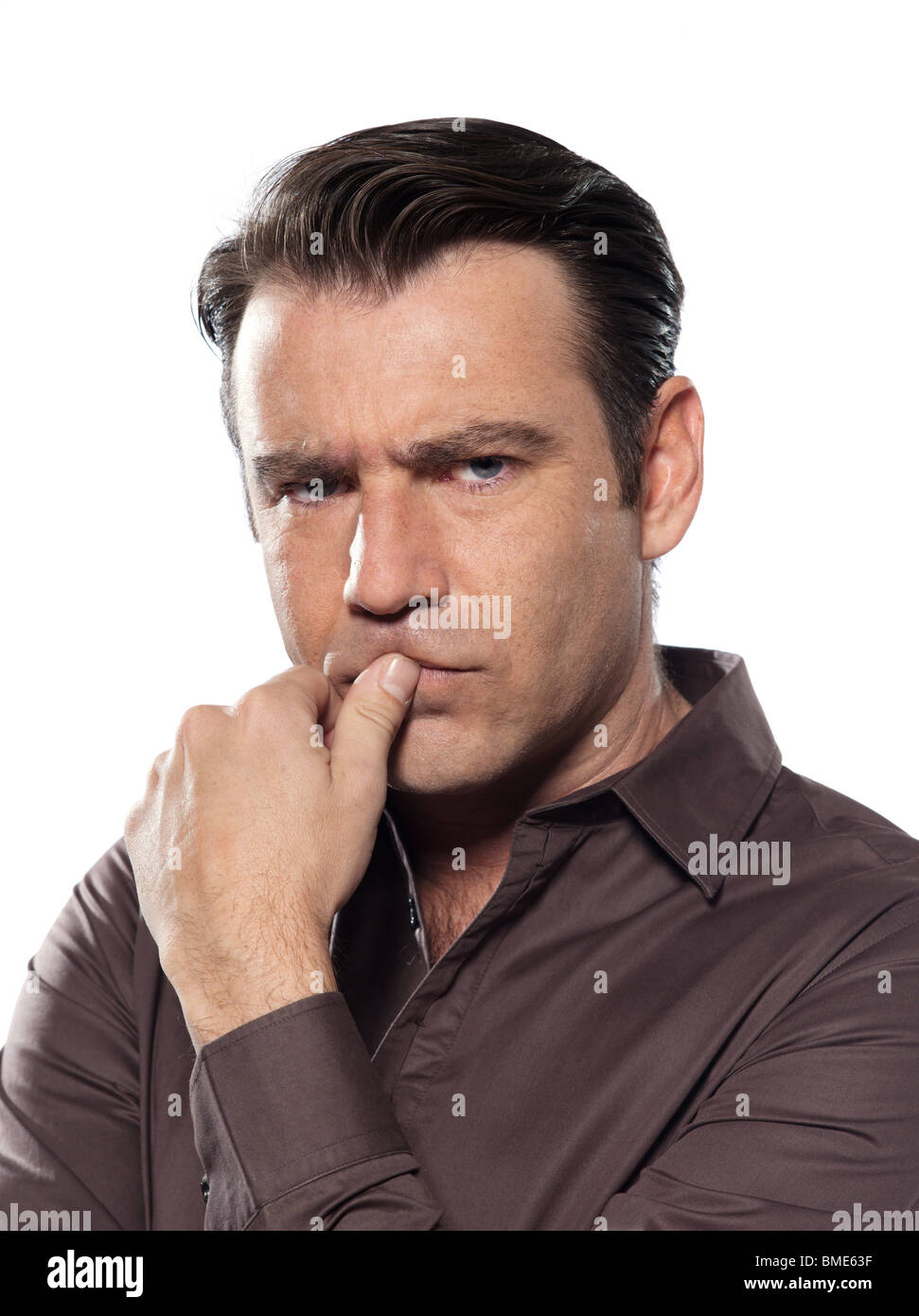 man portrait pucker worried serious studio isolated on white background Stock Photo