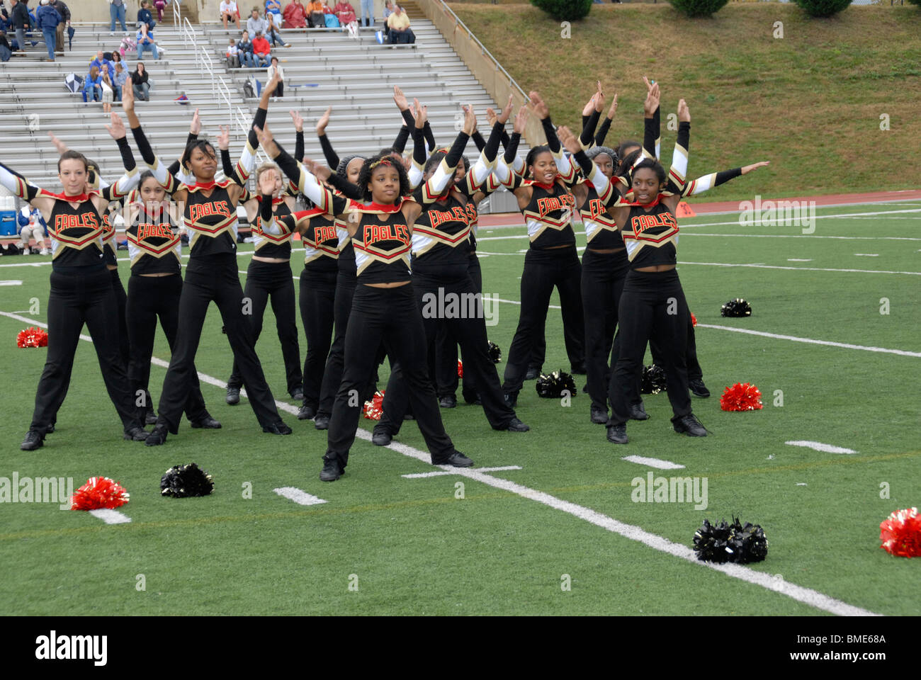 halftime show put on by cheerleaders at high school football game in