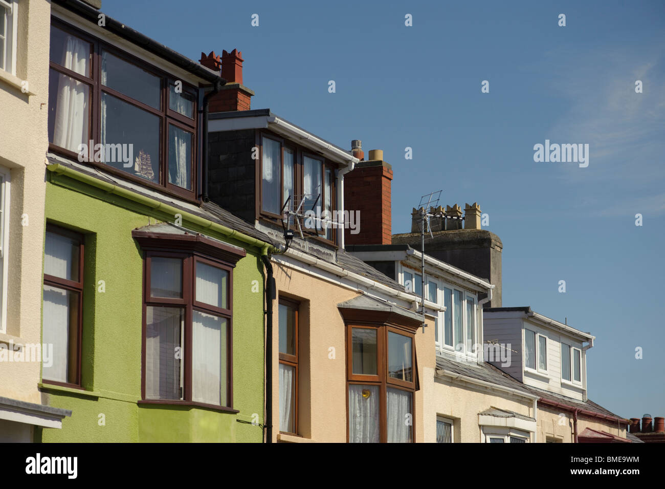 Loft conversions on a row of terraced houses, UK Stock Photo