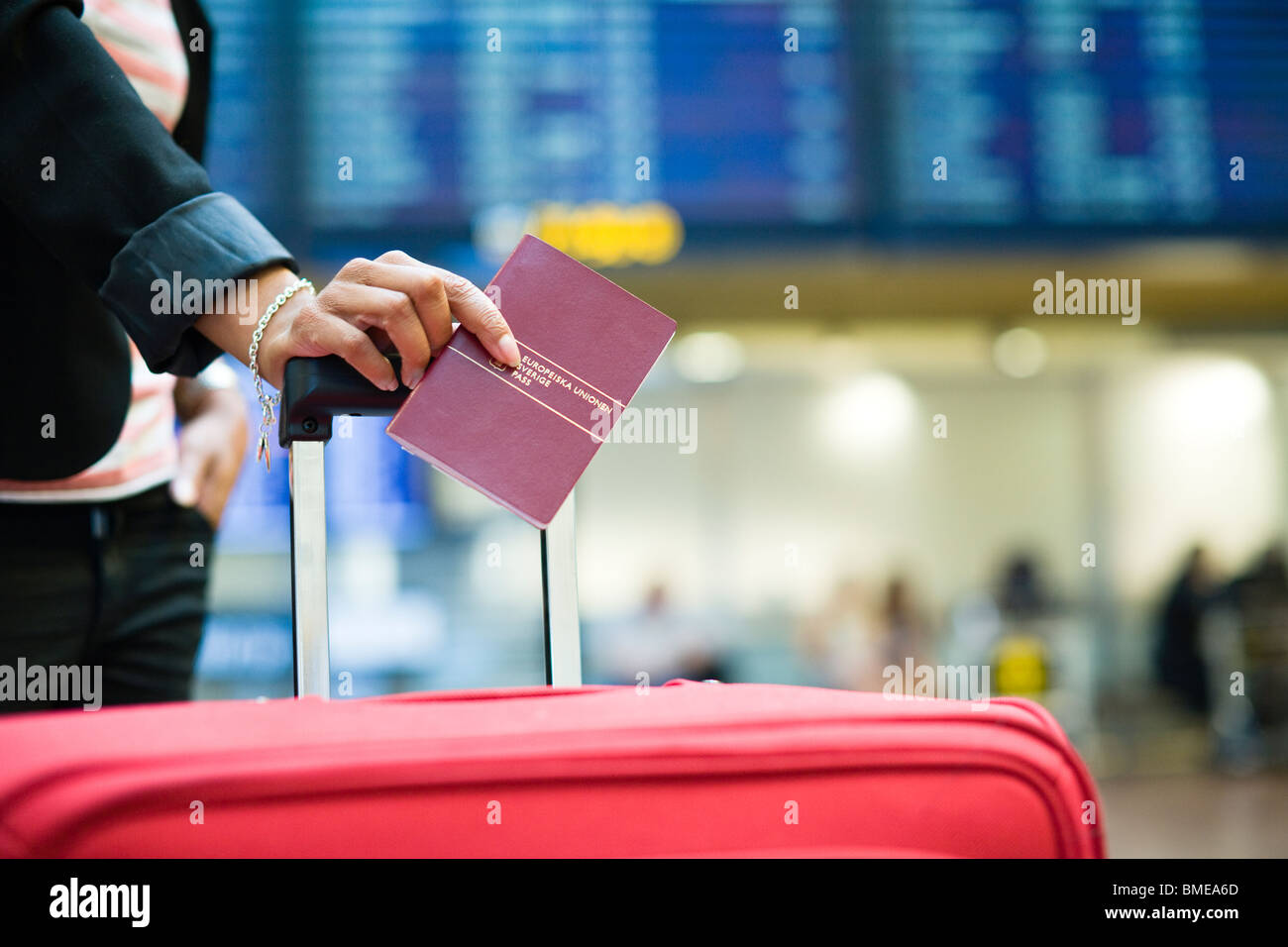 Woman with passport Stock Photo