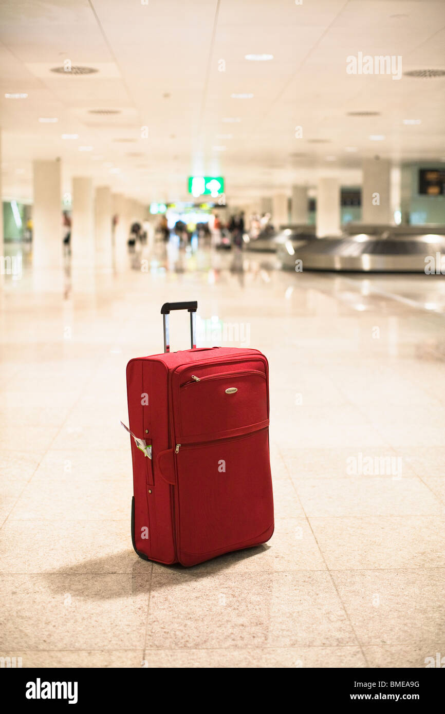 Suitcase at an airport Stock Photo