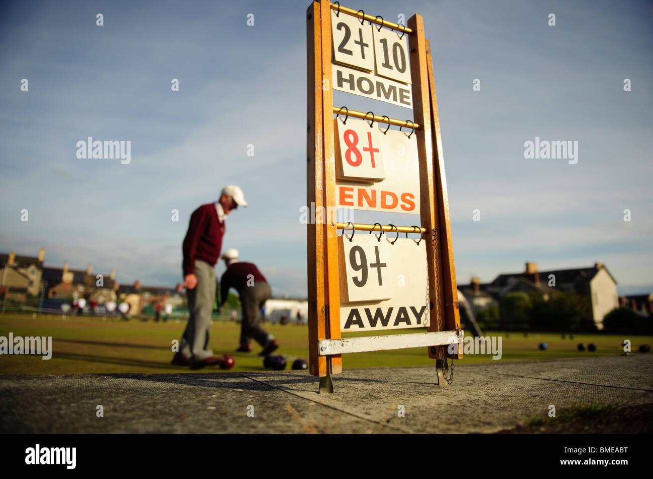 Men playing a game of lawn green bowls on a summer evening, Aberystwyth Wales UK Stock Photo