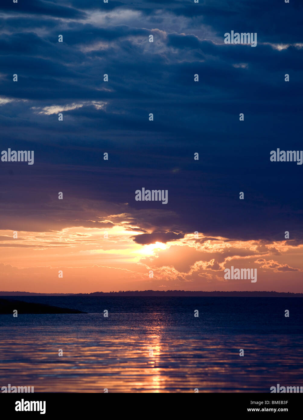 Scenic view of sun setting over sea Stock Photo